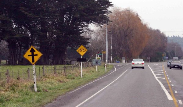 cars driving on roadway