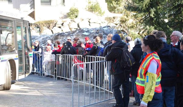 Event attendees waiting for the bus at the Winter Olympics events in Whistler, British Columbia.