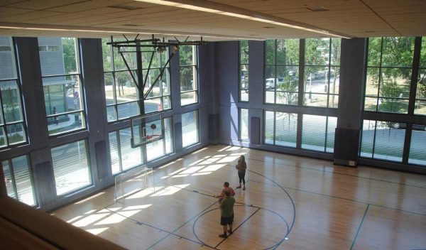 A few people playing basketball on a court