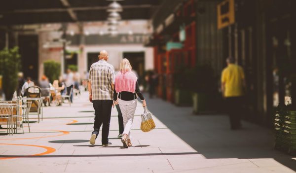 Older couple walking on a street