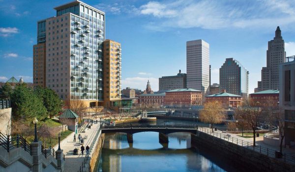 A view of the Woonasquatucket  river and downtown buildings