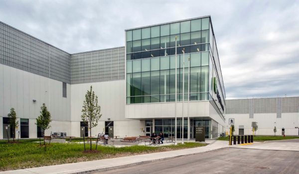 Exterior building with seating in front and parking