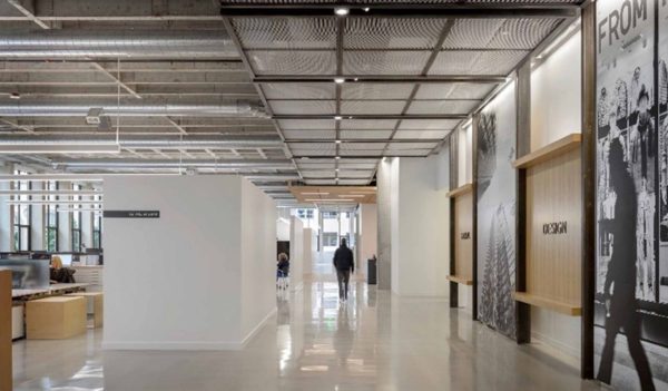 Wide view of open office space with layered lighting at MG2 Offices Seattle.