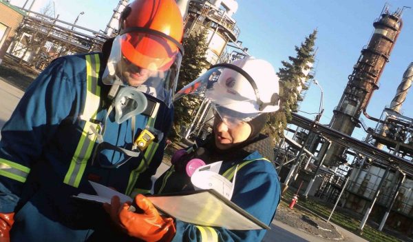 2 people on site reviewing reports