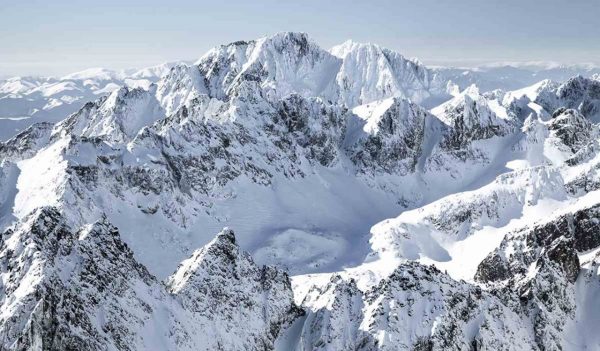 Beautiful snowy peaks in winter. View from peak Lomnicky stit in High Tatras mountains, Slovakia