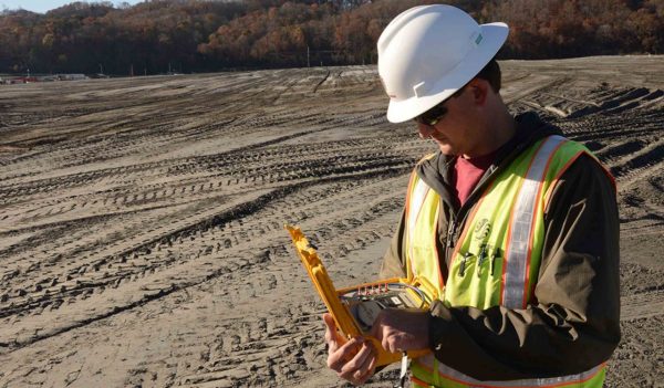 man reading field instruments