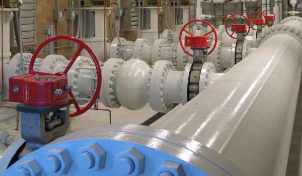 Interior of a water facility showing pipes and valves.