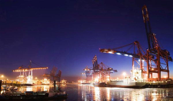 cargo cranes on site at night