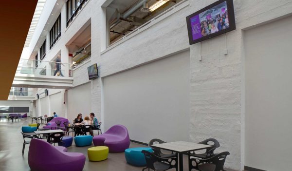 Three-story atrium with collaboration zones at the Cleveland Institute of Art.