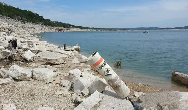 A rocky beach at a lake