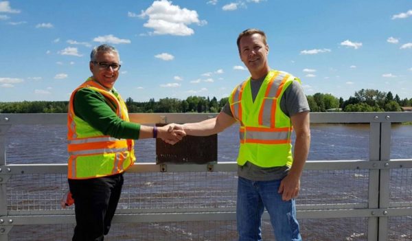 Two field staff handshake