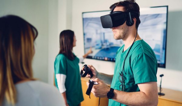 Health colleagues interacting with a VR headset design tool.