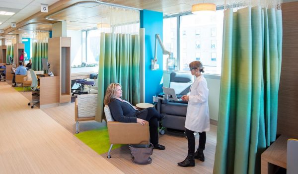 Nurse with a patient in a treatment space