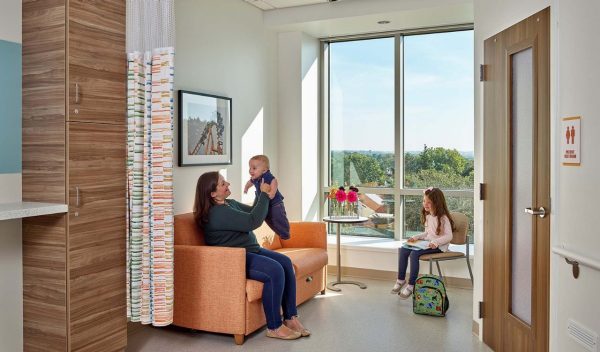 A women with her children in a hospital room