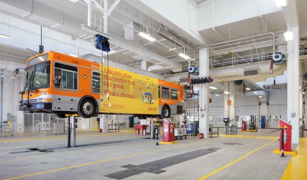 Bus on a lift at LA Metro Division 13 Bus Operations & Maintenance Facility, Los Angeles, California.