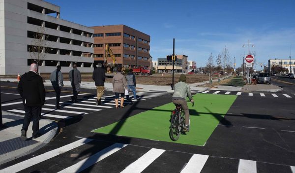 people and cyclist crossing interaction