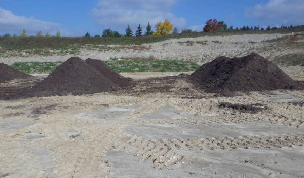 Piles of soil in a field