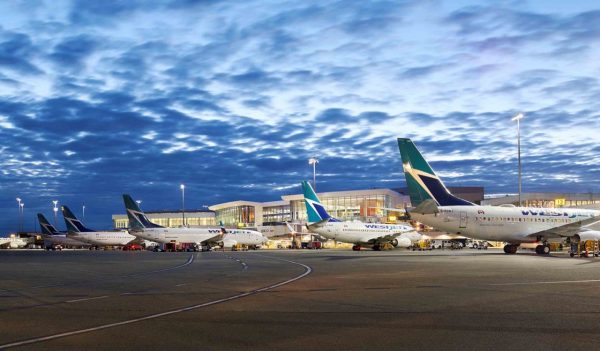 Planes parked at airport terminal