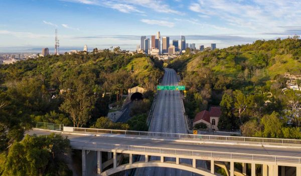 Aerial view of empty freeway streets with no people and no cars in downtown Los Angeles California as result of  coronavirus pandemic or COVID-19 virus outbreak and lockdown.