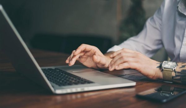 Male hands with laptop