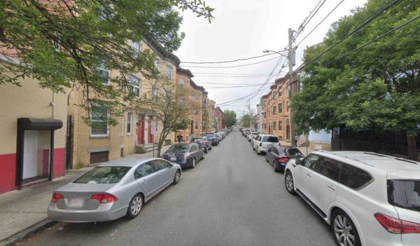 Urban street with vehicles parked