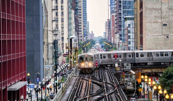 Elevated Train Tracks above the streets and between buildings at The Loop August 3rd, 2017 - Chicago, Illinois, USA