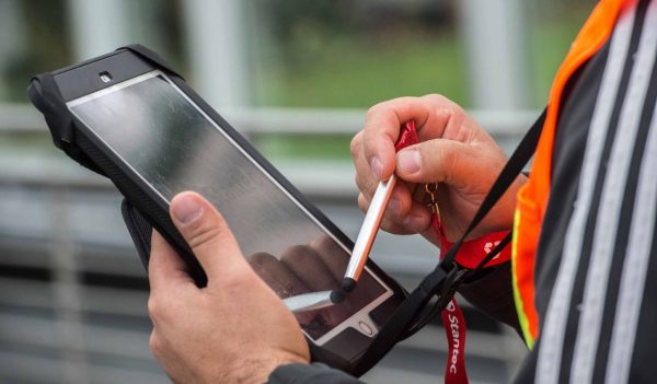 Close-up of person working on tablet