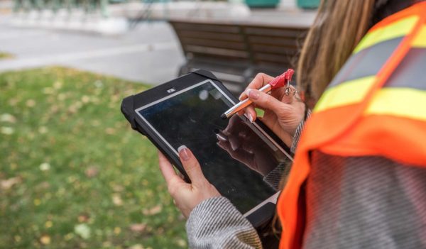 Woman working on a tablet - construction