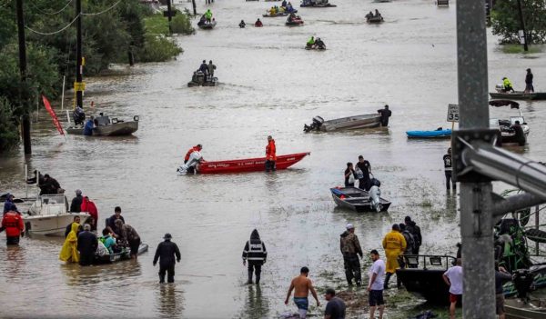 People being rescued from flooded area.