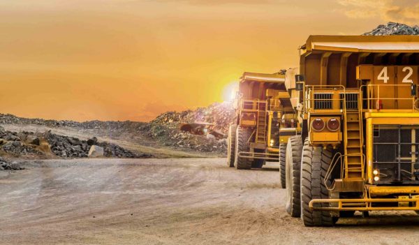 Mining dump trucks transporting Platinum ore for processing