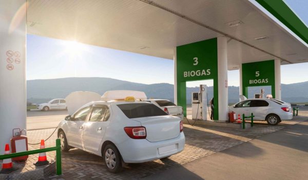 Cars at the biogas filling station. Carbon neutral transportation concept