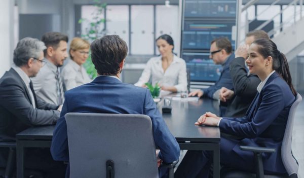 Men and women meeting in a boardroom