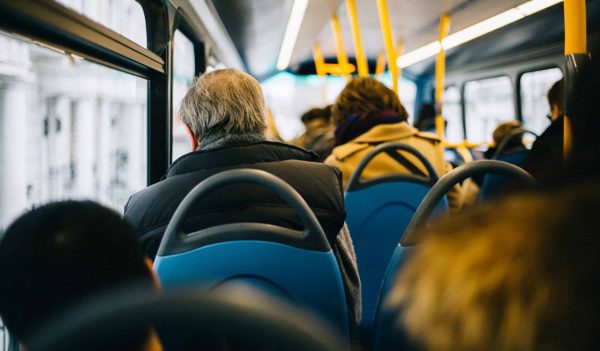 Rear View Of People Sitting In Bus