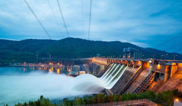 View of a hydroelectric dam, water discharging through locks, long exposure shooting