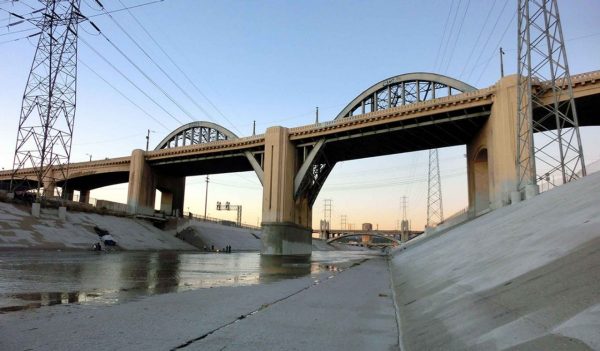 Los Angeles river bridge over a viaduct at dusk.