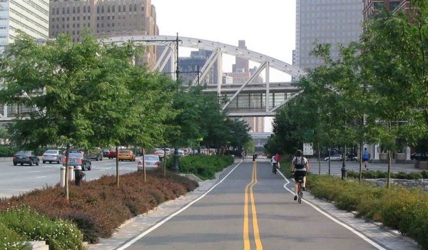 Pedestrian and cycling lane alongside busy roadway.