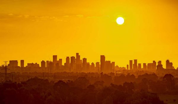 City skyline with an orange sky