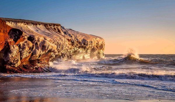 Landscape of waves hitting on the cliffs