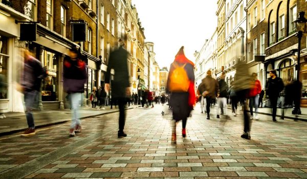 Motion blurred people on shopping street