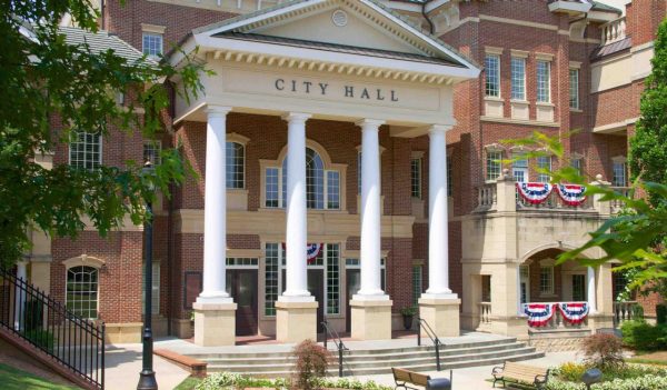 Exterior view of a brick city hall building with columns