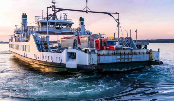 Small ferry transporting vehicles.