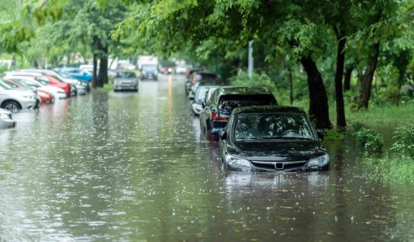 Flooded cars on the street of the city after heavy rain. 