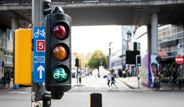 Close-up of a traffic light with a cycling go signal.