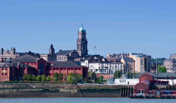 Birkenhead skyline across the Mersey from Liverpool. England.