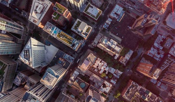 Top down aerial view of Chicago Downtown skyscrapers with antennas. Urban grid with streets and tall buildings