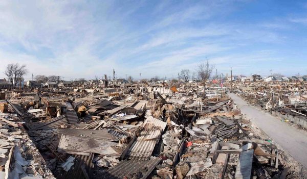 Aftermath of a fire that destroyed multiple houses in a neighborhood.