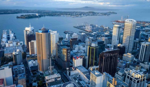 Aerial view of Auckland, New Zealand along the port on an overcast day.