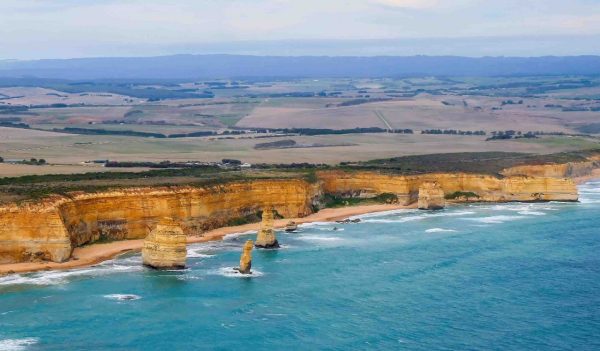 Aerial view of the Australian coastline at the Twelve Apostles in the Port Campbell National Park - Collection of limestone stacks in the Tasman Sea off the coast of Victoria, Australia