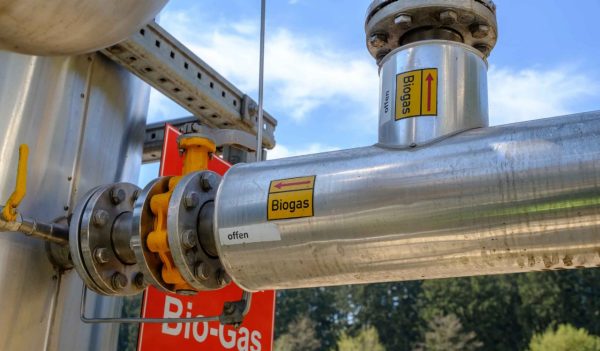 Close-up of a biogas pipe, leading into a storage tank.