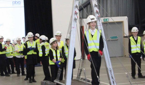 children wearing hardhats